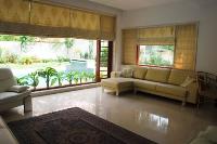 the living room windows look out onto the pool.